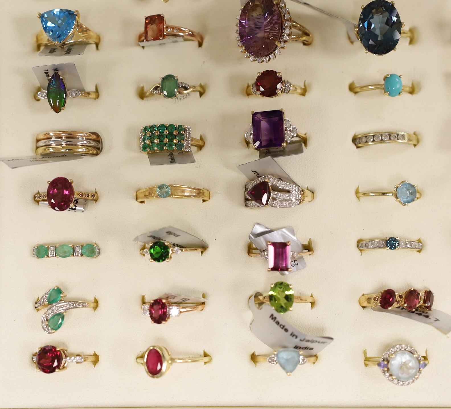 Forty three assorted modern 9ct gold and gen set dress rings including amethyst, emerald and garnet, one 18ct gold and gem set ring and six assorted 925 rings, in ring box.